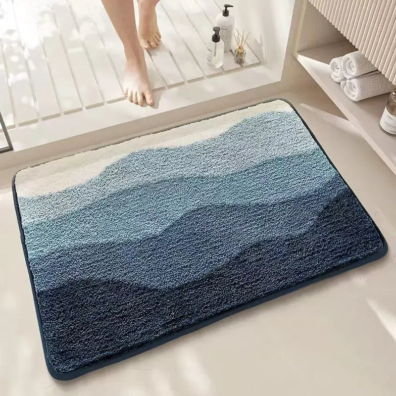 Square rainbow pattern carpet floor mat with a blue and white sky sea colour scheme and a plastic bottom.