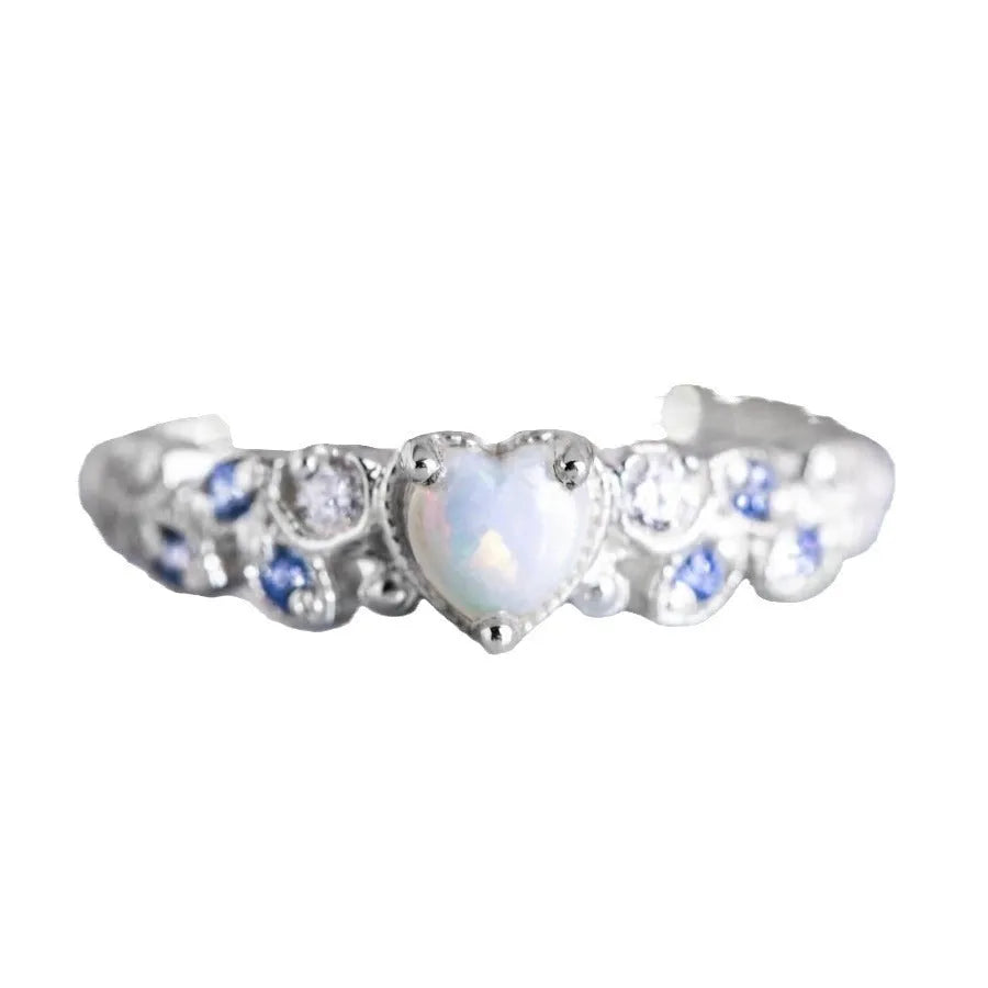 Women's white heart-shaped ring with floral and ocean opal design elements
