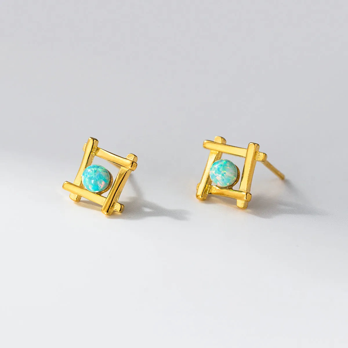 Women's geometric cross quadrangle stud earrings in sterling silver with gold or silver finish