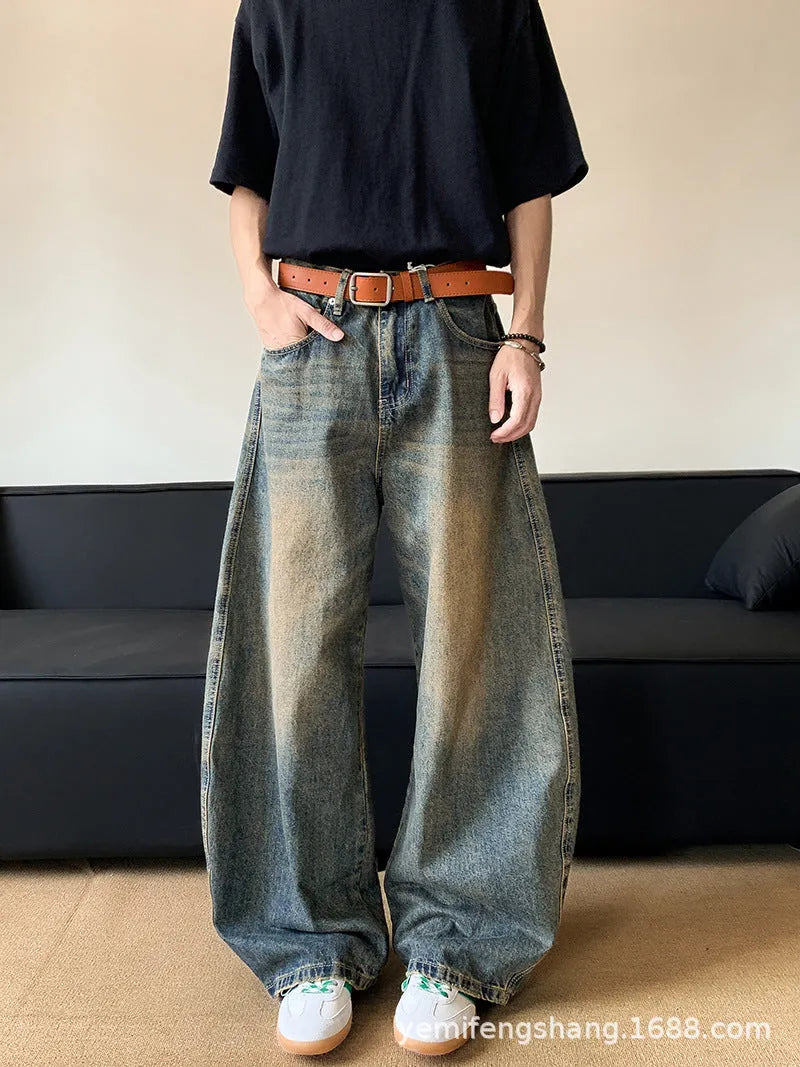 Men's retro blue distressed denim jeans with slim wide-leg fit showing micro elasticity fabric