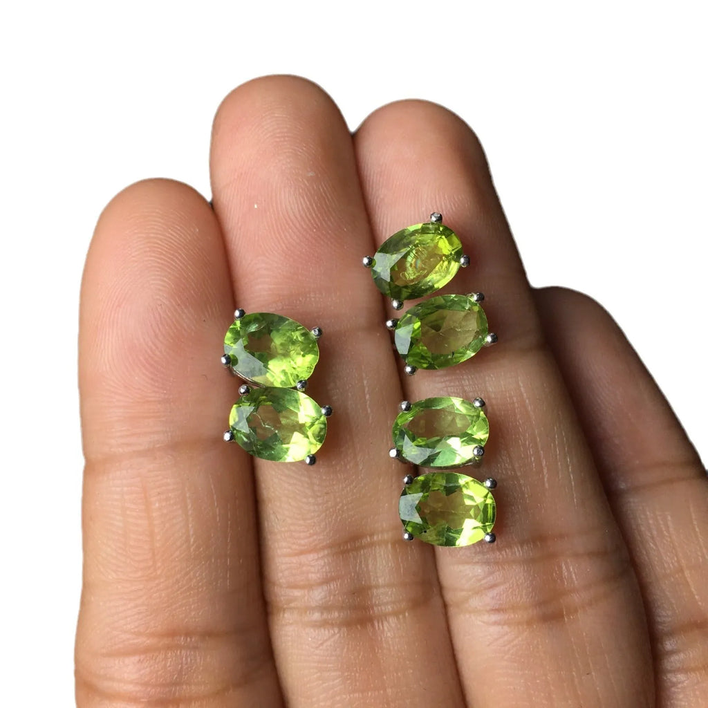 S925 silver stud earrings with a grass green natural olivine gemstone, elliptical cut.