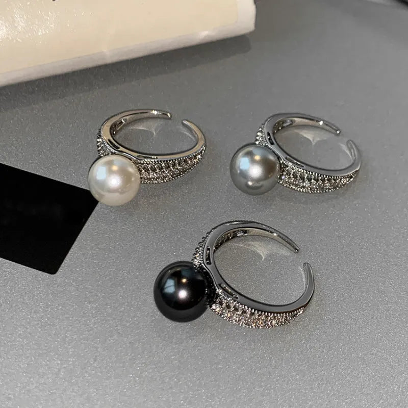 Geometric copper ring with black pearl and adjustable opening for women.