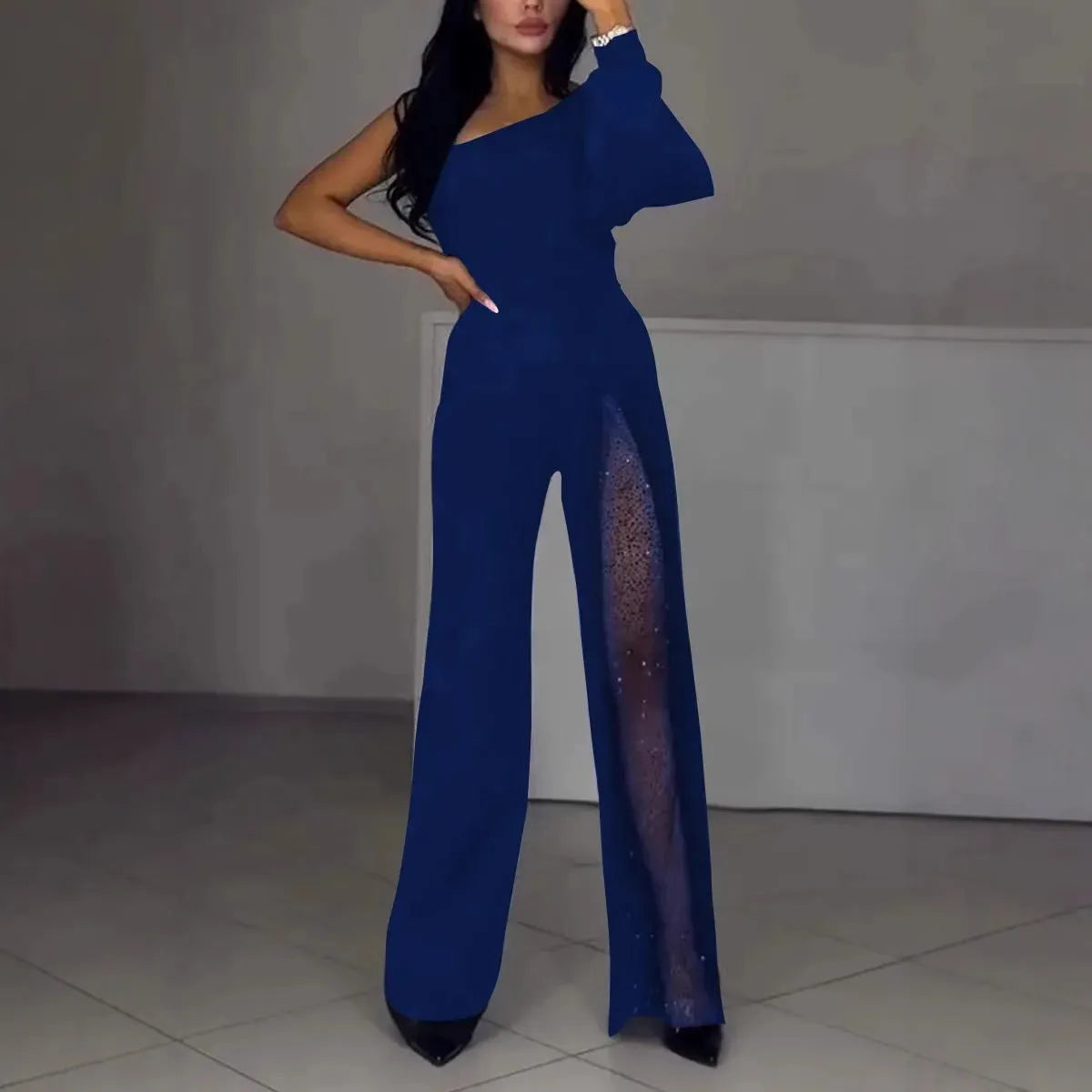Black women's jumpsuit with an oblique shoulder neckline and a high slit on the leg.