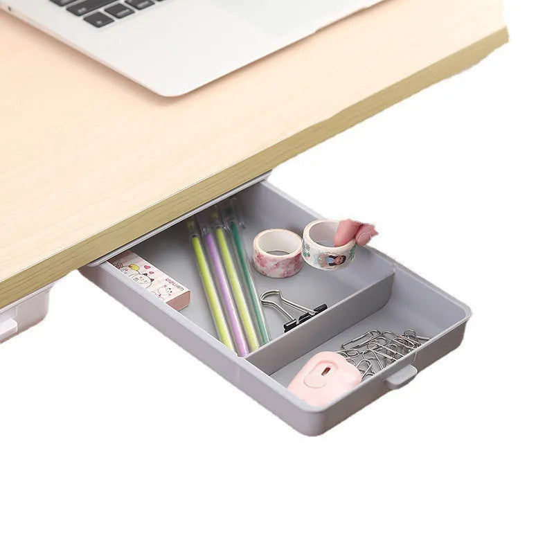 Adhesive under-table plastic storage drawer with covered design and grid pattern organisation in solid colours