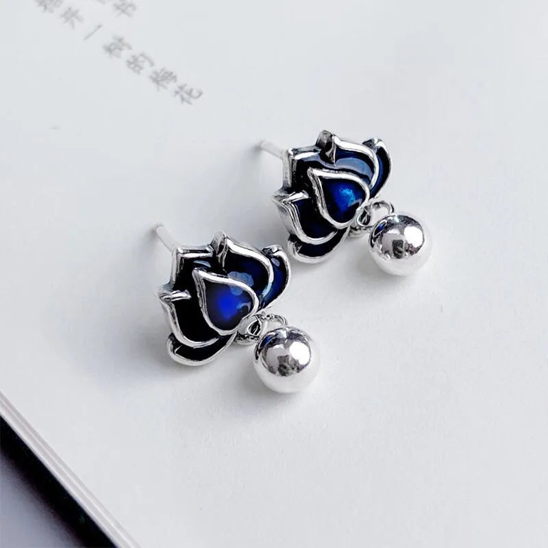 Blue lotus earrings with retro seedpod tassel design and flower shape measuring 1.2cm wide