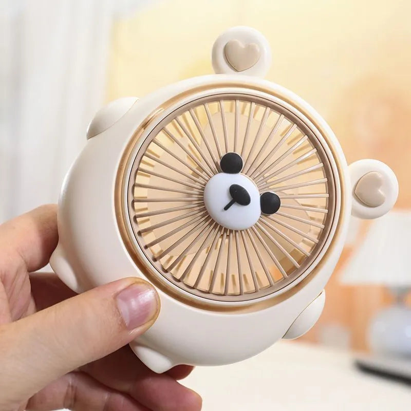 Dog-shaped desktop USB fan showing colour options including brown bear and pink puppy variants