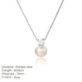 St Delan stainless steel necklace with imitation pearl and zircon pendant in gold colour.