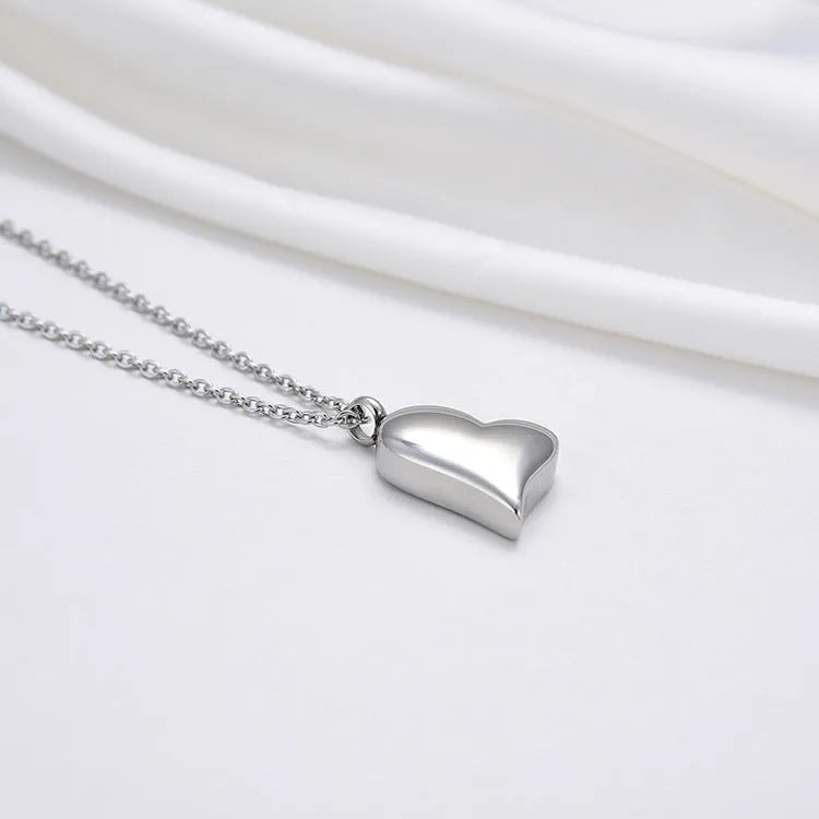 Silver curved peach heart stainless steel pendant necklace with adjustable chain length