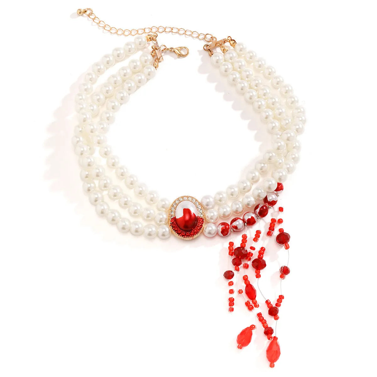 Gold Halloween pearl collar jewellery set with necklace, bracelet, and stud earrings on white background