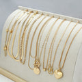 10 piece gold electroplated women's necklace set with adjustable chain length on display