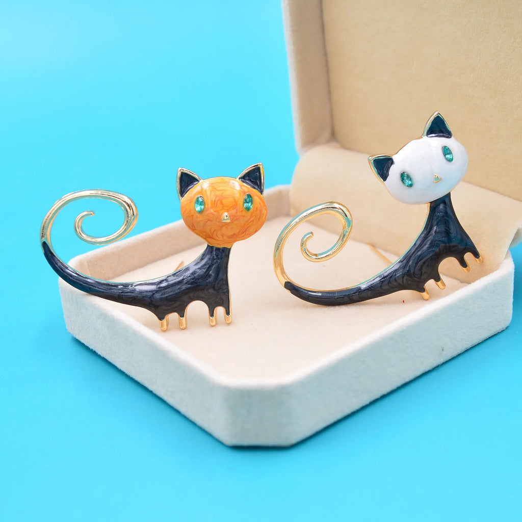 Personalised painted cat tail up brooch in alloy metal, available in white or orange colour options.