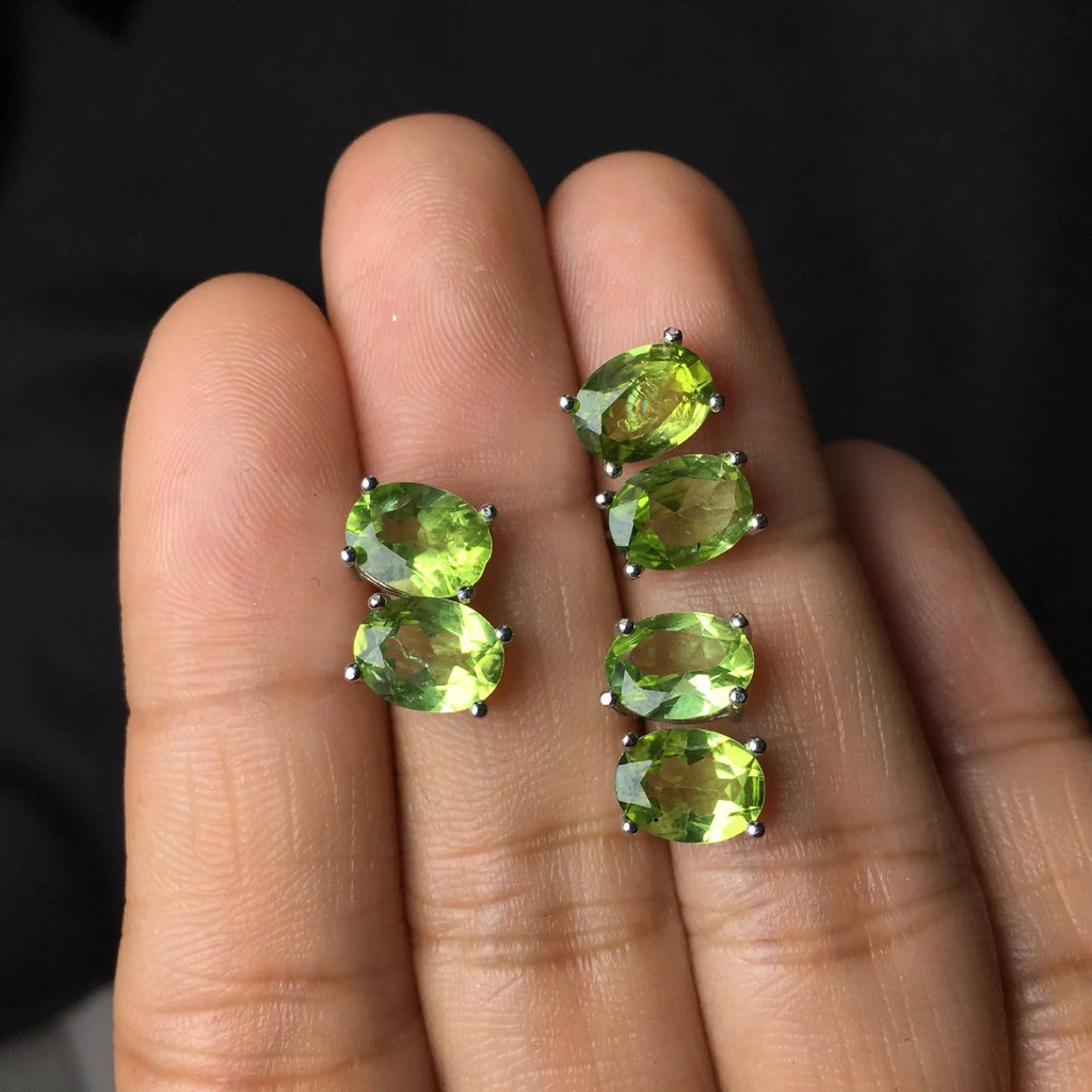 S925 silver stud earrings with a grass green natural olivine gemstone, elliptical cut.