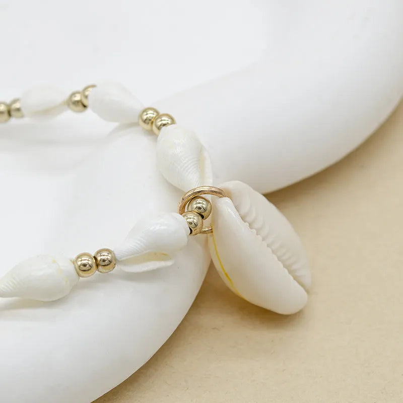 White conch shell bead necklace with mother pearl shellfish pendant on electroplated chain