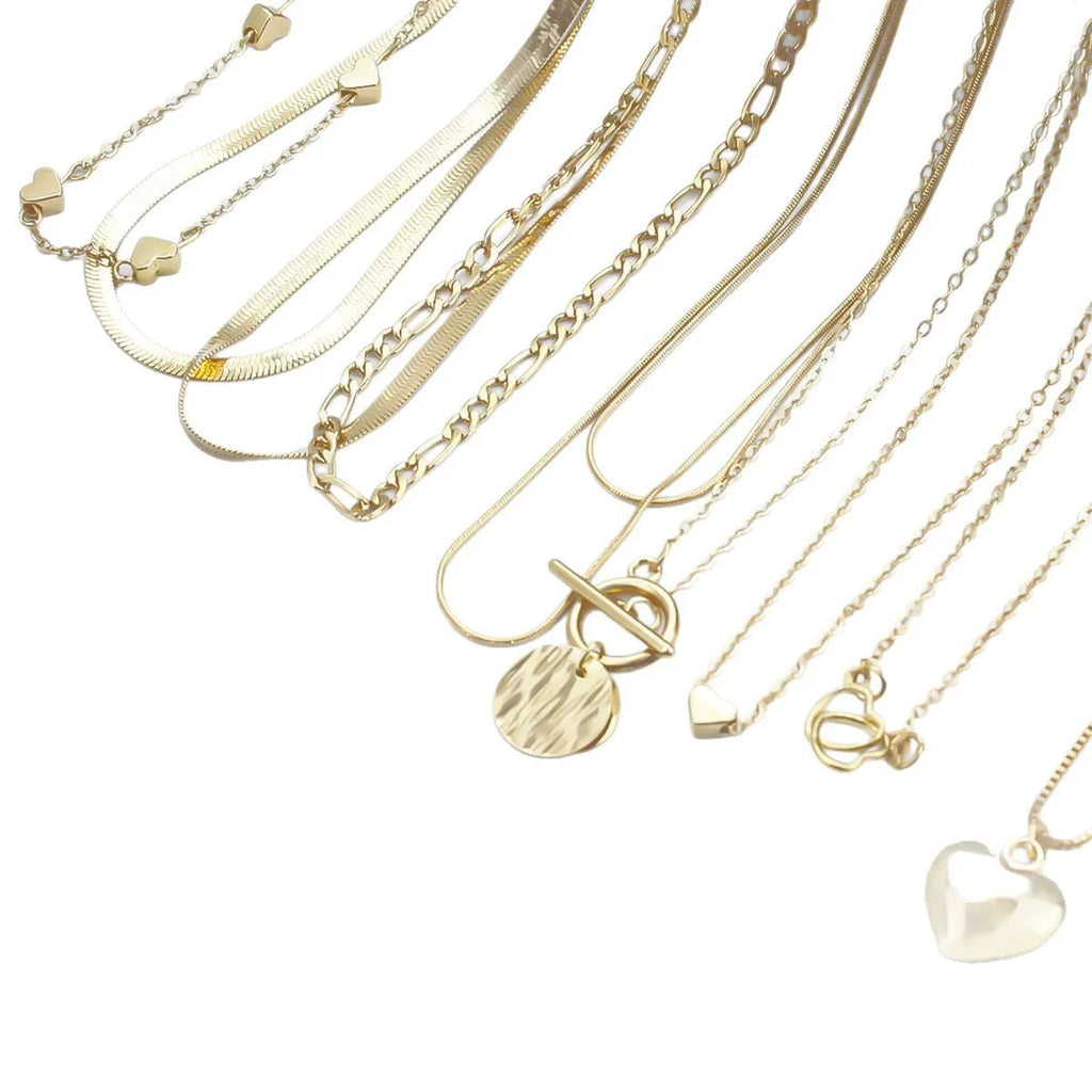 10 piece gold electroplated women's necklace set with adjustable chain length on display