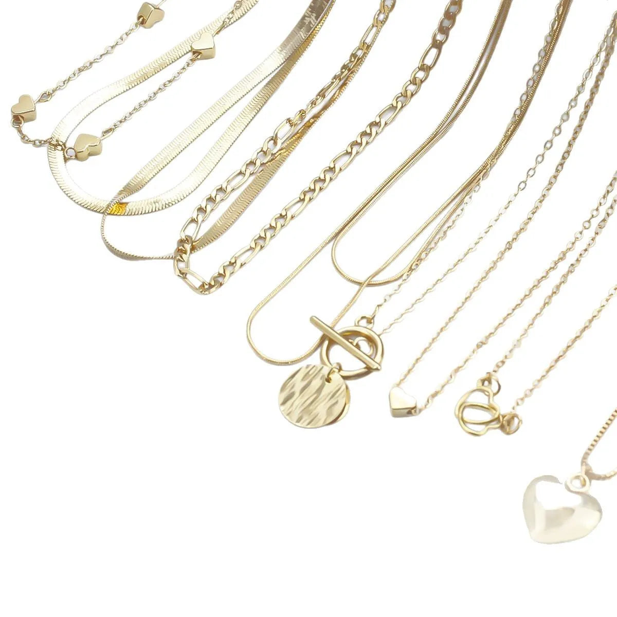 10 piece gold electroplated women's necklace set with adjustable chain length on display
