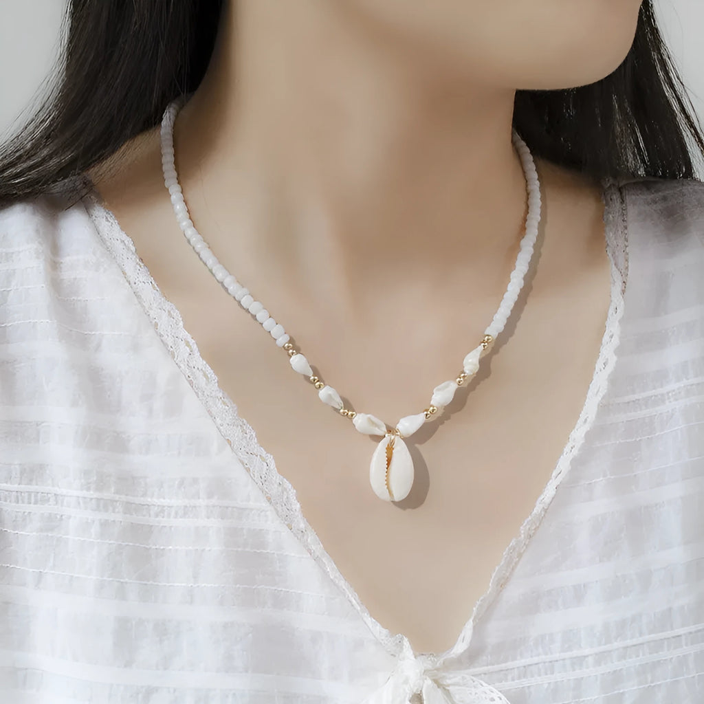 White conch shell bead necklace with mother pearl shellfish pendant on electroplated chain