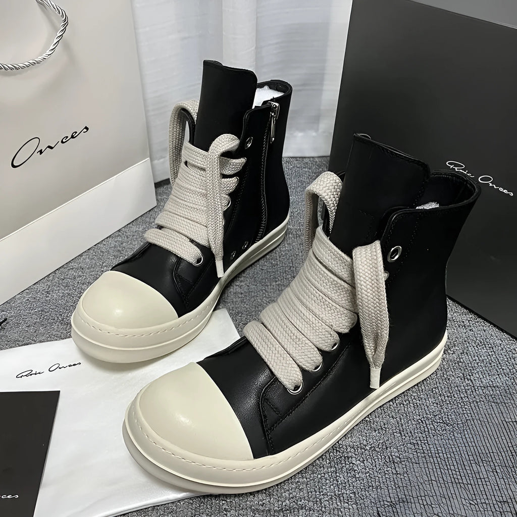 High-top leather sneakers with side zipper in black, white, and red colour options