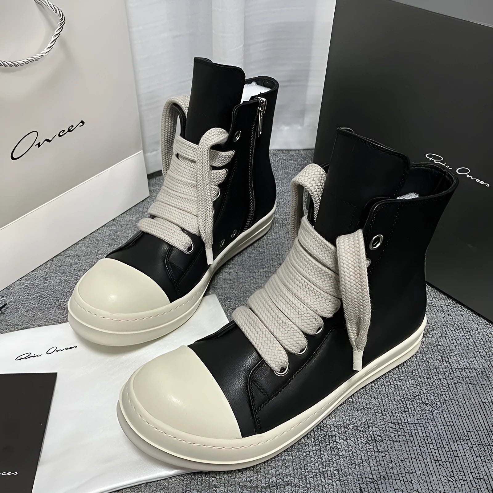 High-top leather sneakers with side zipper in black, white, and red colour options