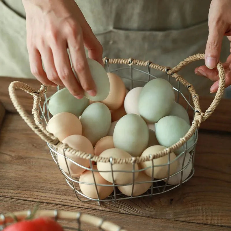 Nordic iron wire woven storage basket in binaural woven style, small size, containing fruit on a kitchen countertop