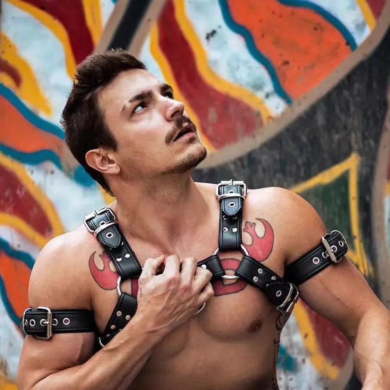 Black leather chest harness with metal buckles and adjustable straps for muscle bondage styling