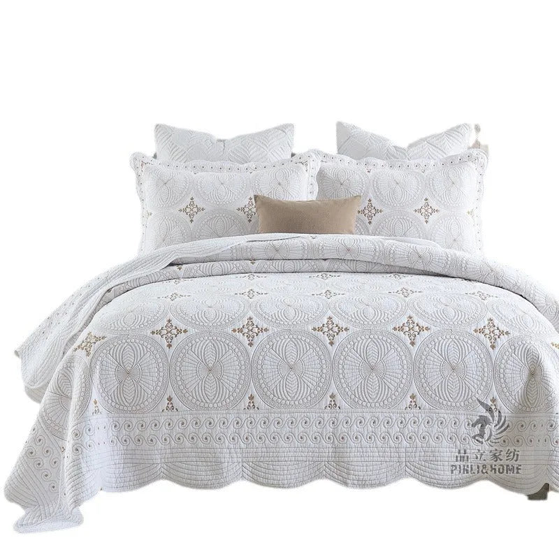 Pure cotton embroidered bedspread and pillowcase set in solid colour on a 1.8 metre bed.