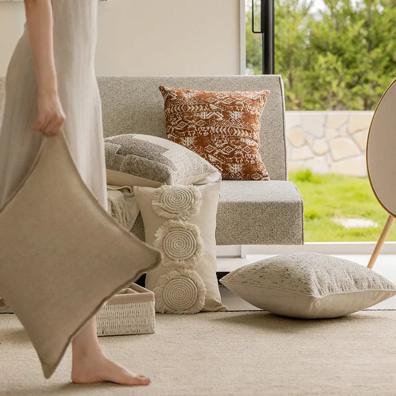 45cm square cushion pillow in solid colour with decorative edge stitching on sofa
