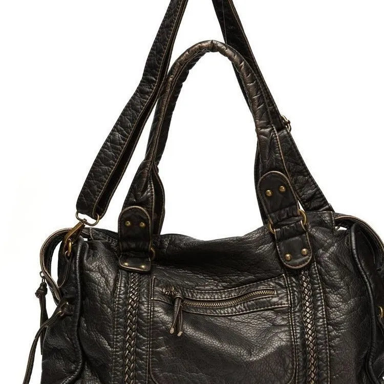Women's brown soft PU leather retro messenger bag with a single shoulder strap, shown open to reveal internal zippered organisers.