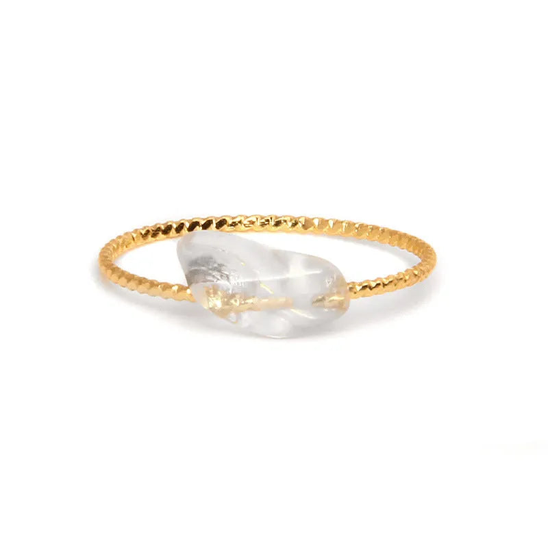 Geometric silver-toned ring setting with a central oval of blue and white banded agate stone on a woman's hand.