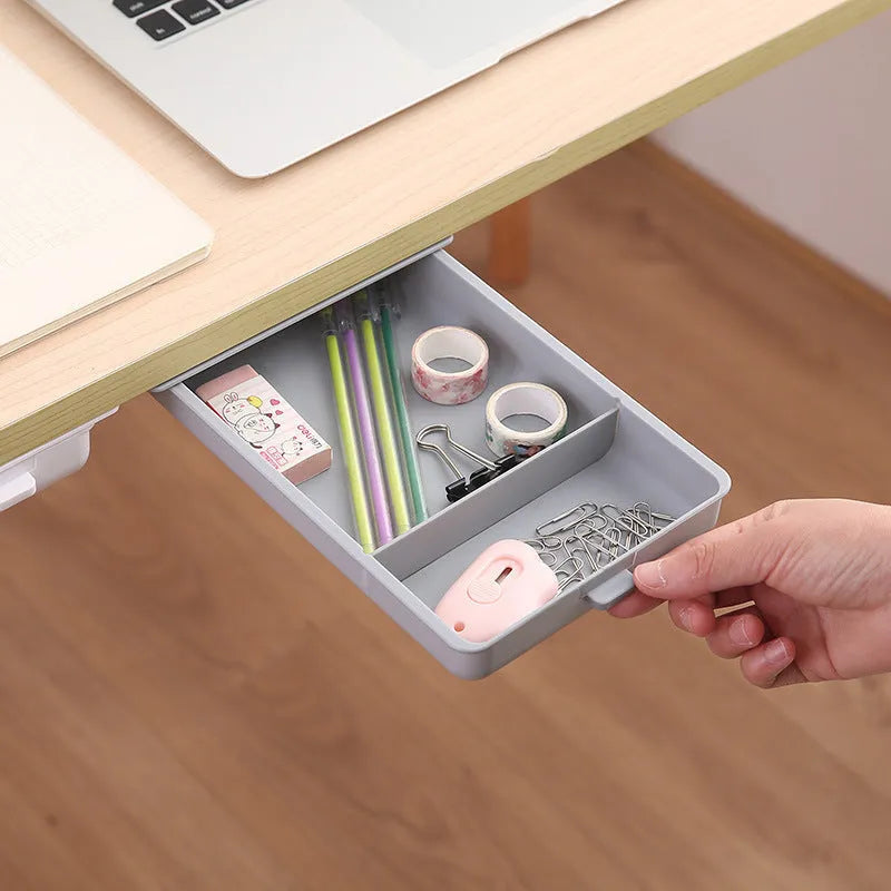 Adhesive under-table plastic storage drawer with covered design and grid pattern organisation in solid colours