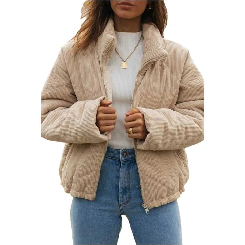 Women's apricot coloured corduroy jacket with a stand collar and front zipper on a hanger.