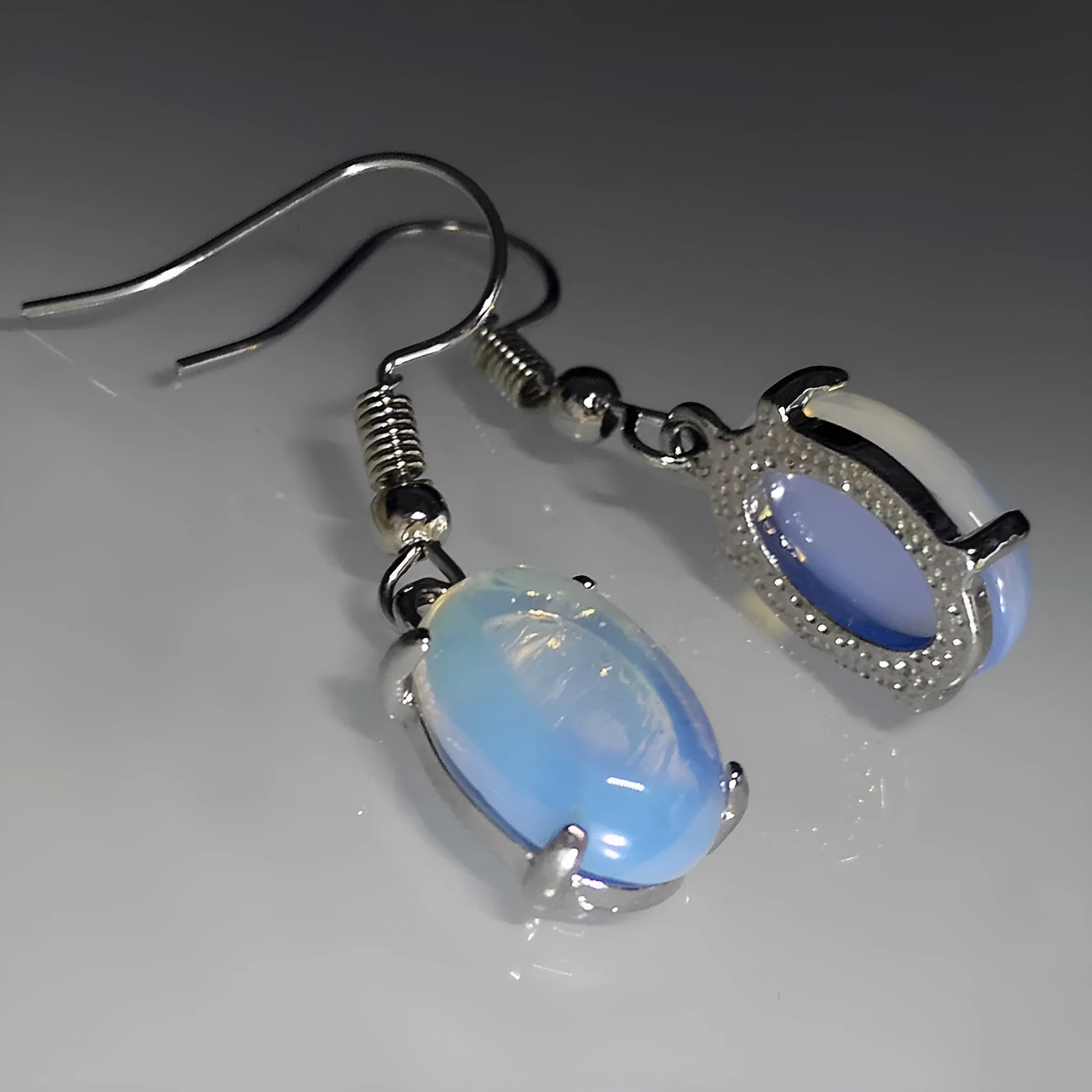 Moonlight white opal earrings with cross pendant in retro drop shape design