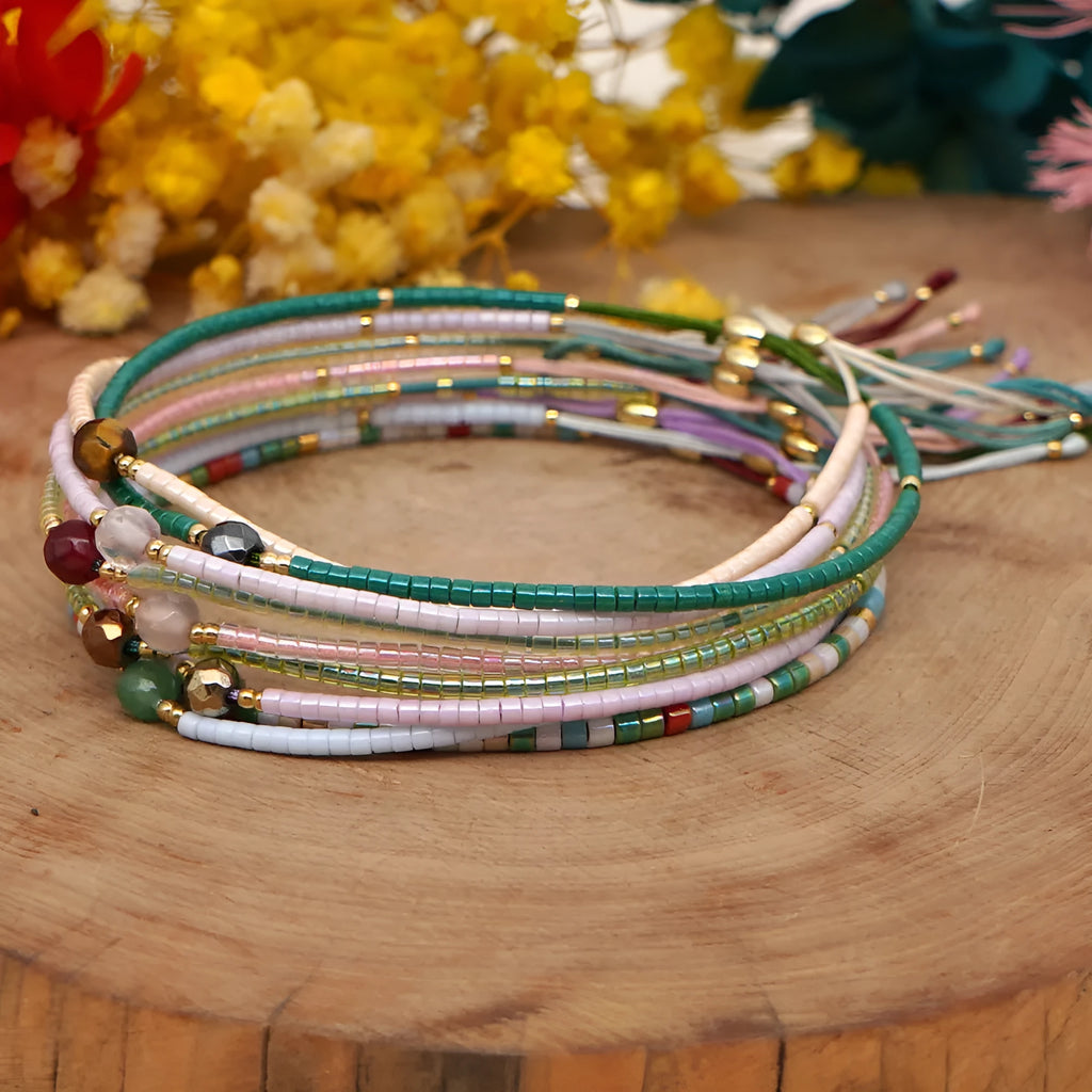 Handmade women's beaded bracelet with colourful glass and glaze beads in geometric bohemian style