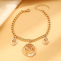 Gold spiral donut geometric jewellery set with adjustable necklace, matching bracelet, and earrings on a white background.