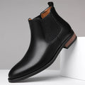 Men's black Chelsea boots with pointed toe design and artificial PU leather construction