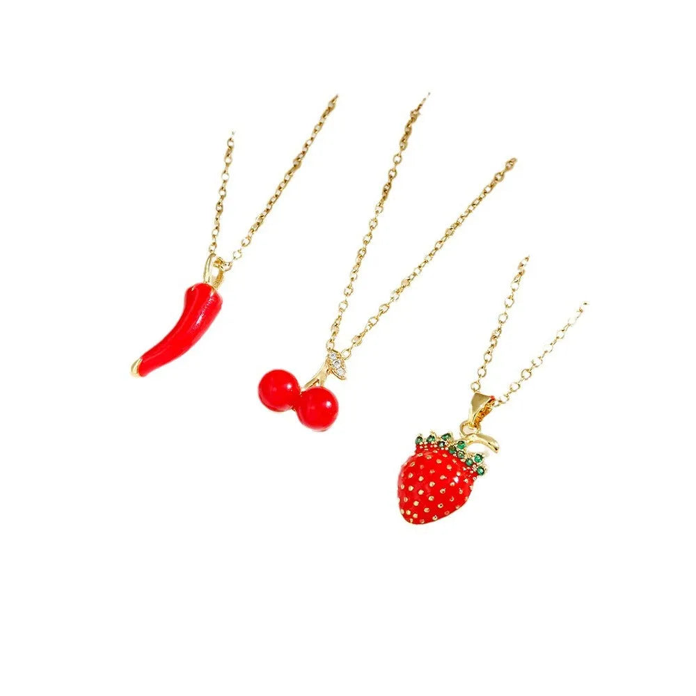 Women's delicate titanium steel necklace with a small cherry charm pendant on an O-ring chain.