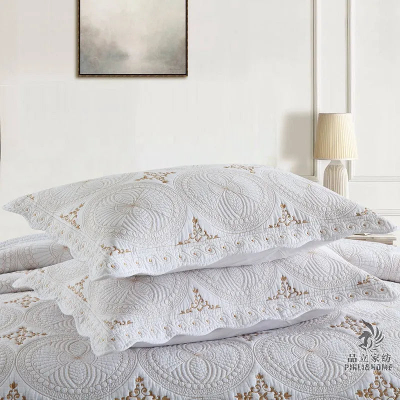 Pure cotton embroidered bedspread and pillowcase set in solid colour on a 1.8 metre bed.