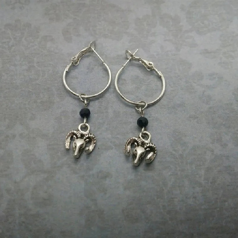 A pair of silver-coloured alloy round ring earrings for women featuring a Tibetan antelope design.