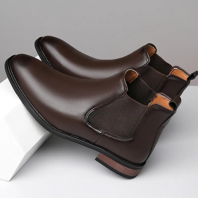 Men's black Chelsea boots with pointed toe design and artificial PU leather construction