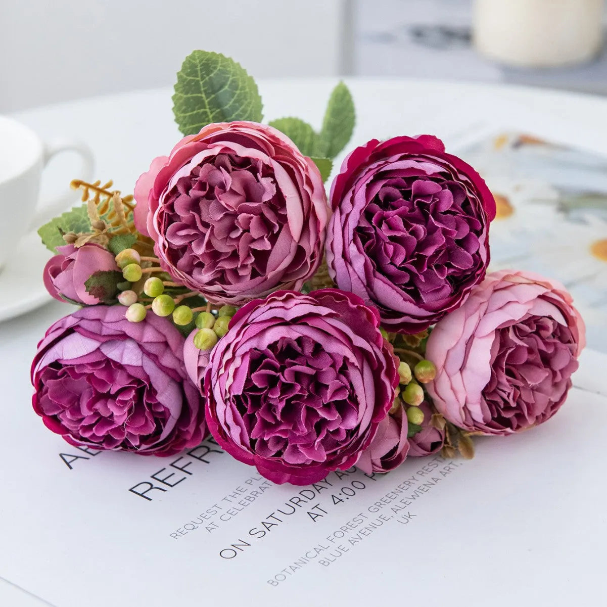 Silk artificial peony bouquet in champagne colour for wedding or home decoration.