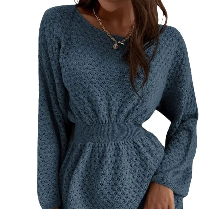 Blue women's knitted dress with hand-crocheted floral details on the front, showing fitted waist and round neck.