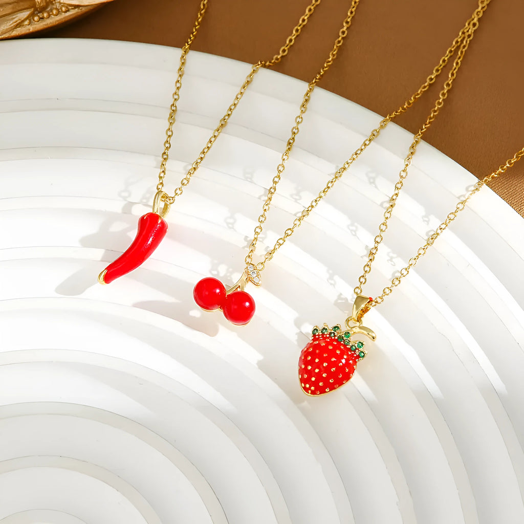 Women's delicate titanium steel necklace with a small cherry charm pendant on an O-ring chain.