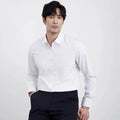 Man wearing a wine red slim fit long sleeve casual business shirt.