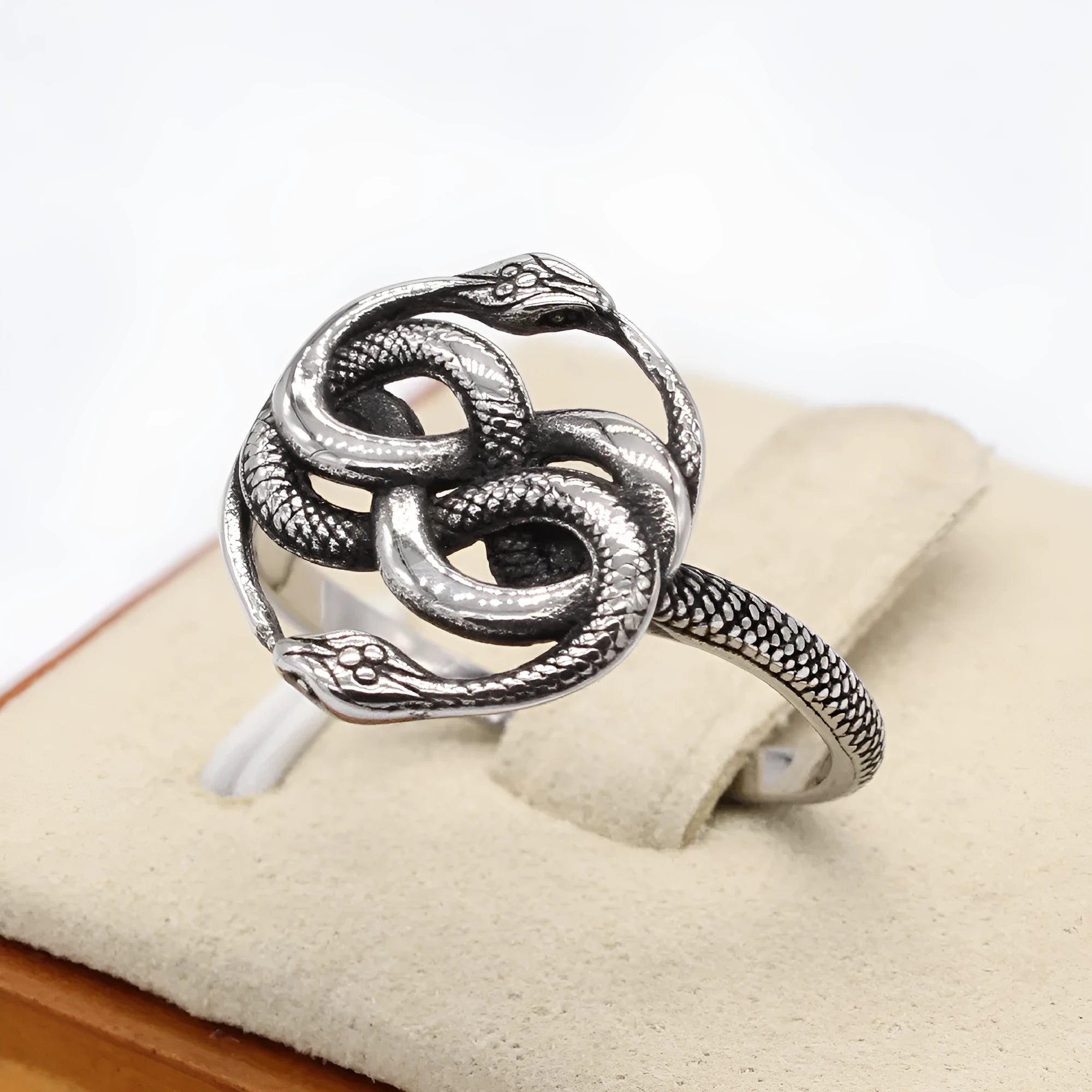 Retro double snake ring in titanium steel with steel colour finish showing entwined snake design