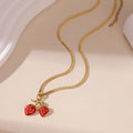 Stainless steel strawberry fruit pendant necklace in red and white gradient colour options.