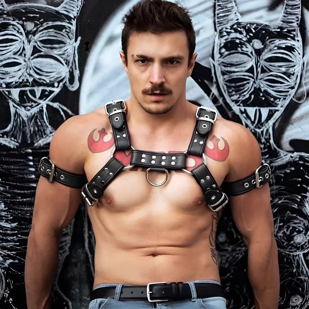 Black leather chest harness with metal buckles and adjustable straps for muscle bondage styling