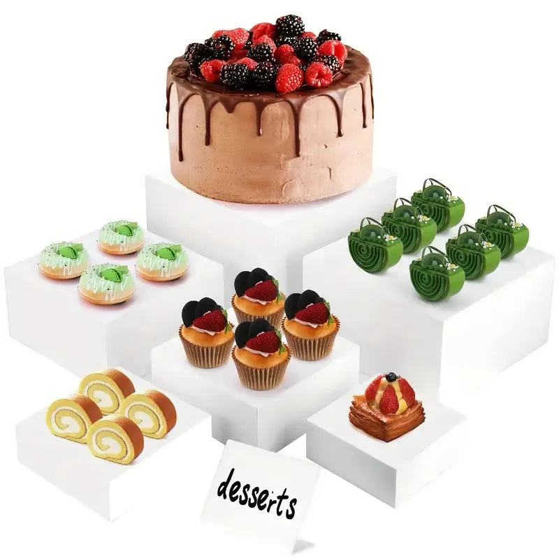 White plastic Suit Cube dessert display stand with six tiers showing cupcakes