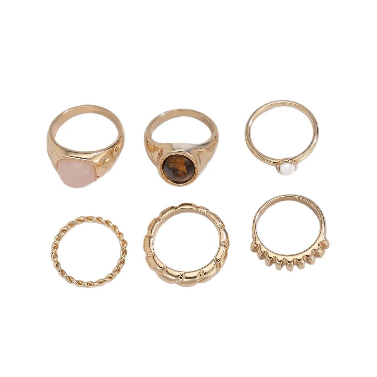 Six light gold geometric alloy rings with electroplated finish displayed together