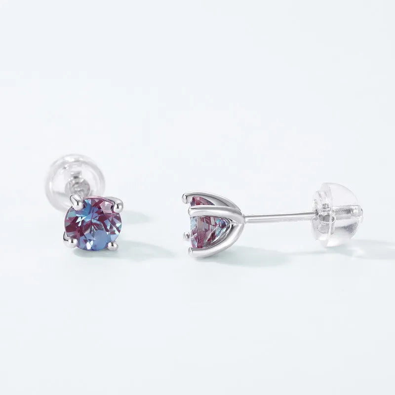 Simple geometric round ear studs in silver with a purple-green cultivate Alexandrite stone.