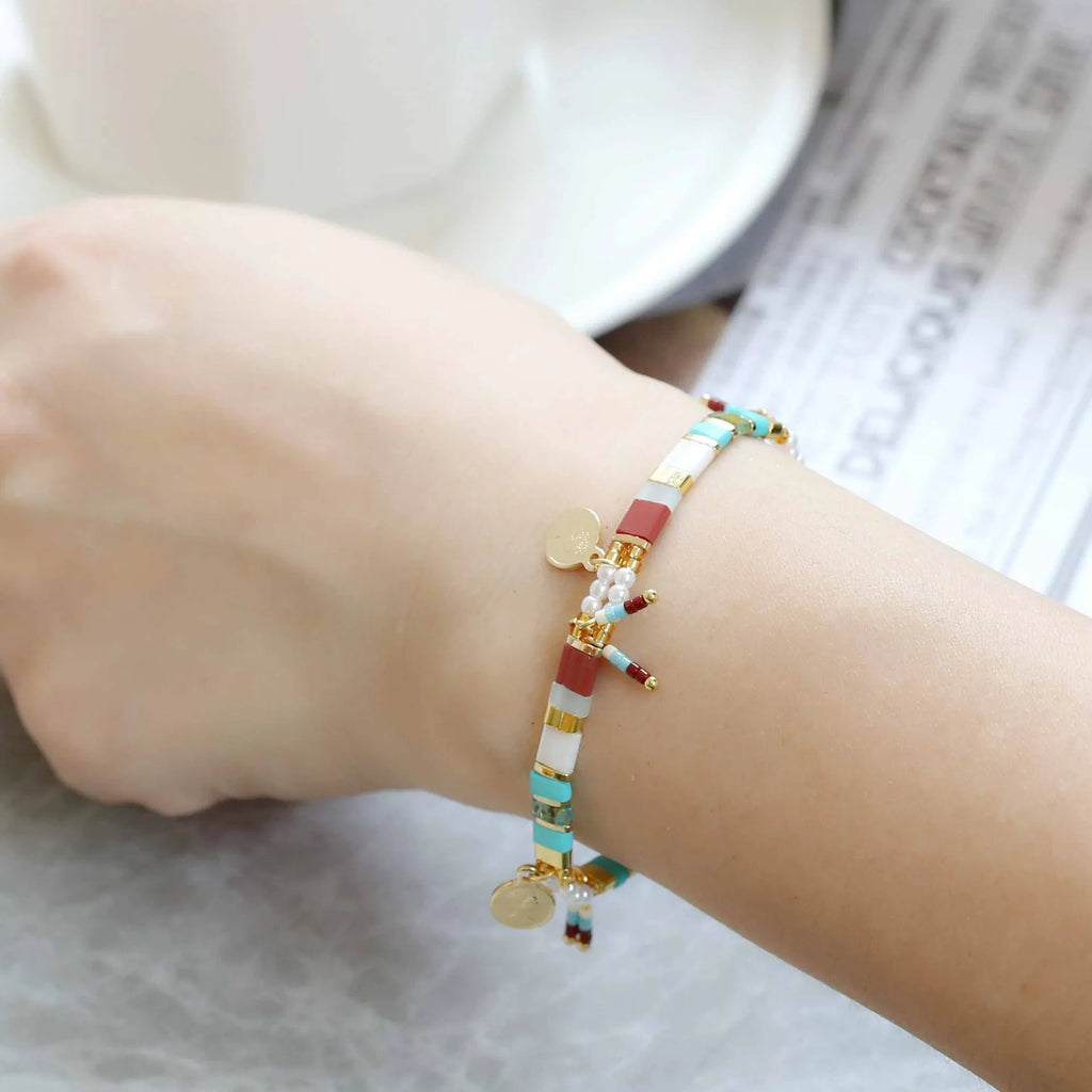 Women's handmade bracelet with imitation pearls and coloured glass beads in original design