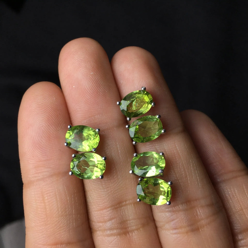 S925 silver stud earrings with a grass green natural olivine gemstone, elliptical cut.